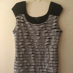 Black and white striped women’s top with ruffles.